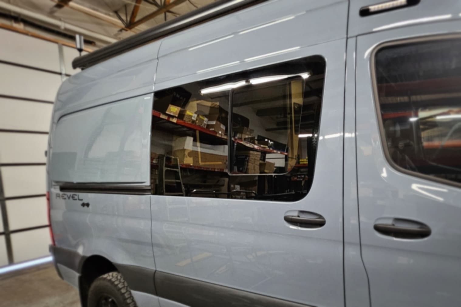 Replacement sliding-door window installed on a Winnebago Revel